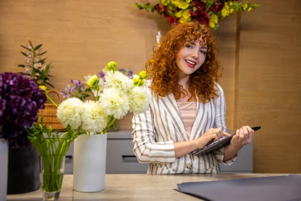 Flower Shop Long Haired Ginger Young Woman Looking Involved While — Stock Photo, Image