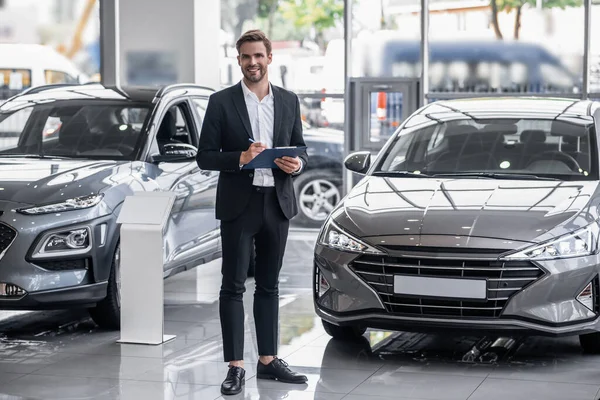 Presenting New Car Male Sales Manager Car Salon — Stock Photo, Image