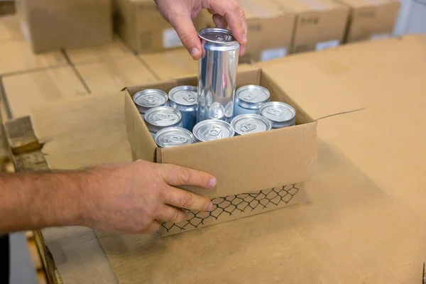 Cropped Photo Caucasian Male Hands Placing Sealed Metallic Can Cardboard — Stock Photo, Image