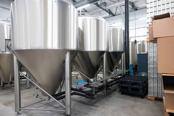 Row Stainless Steel Beer Fermentation Tanks Neighboring Canned Drinks Stacked — 스톡 사진