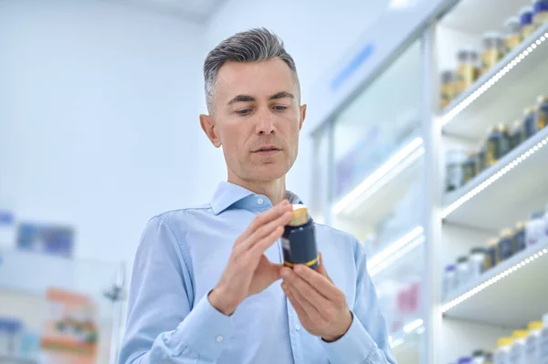 Choosing Supplements Mid Aged Man Choosing Supplements Drugstore — Foto de Stock