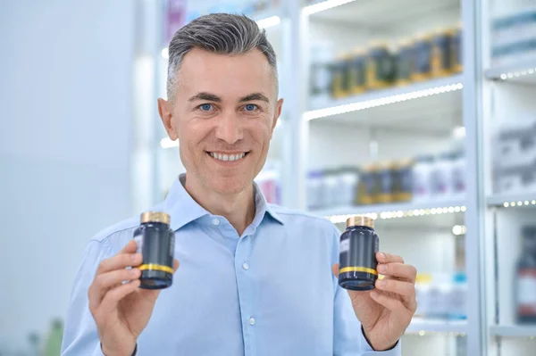 Healthcare Short Haired Mature Man Jars Supplements Drugstore — Photo