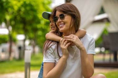 Togetherness. Cute family enjoying good weather in a park