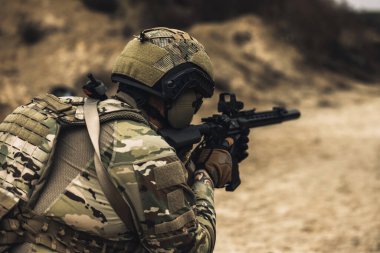 Sniper. Sniper with rifle on a position