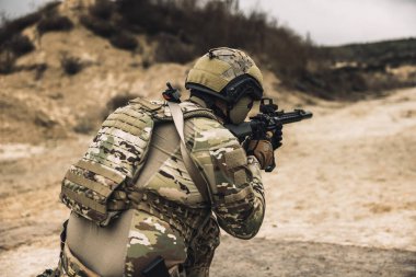 Sniper. Sniper with rifle on a position