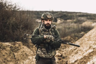 Shooting range. A soldier with a rifle on a shooting range
