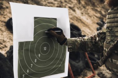 Target. Soldier marking the target for shooting