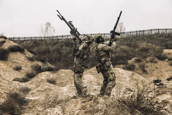 Shooting. Two soldiers with their rifles shooting