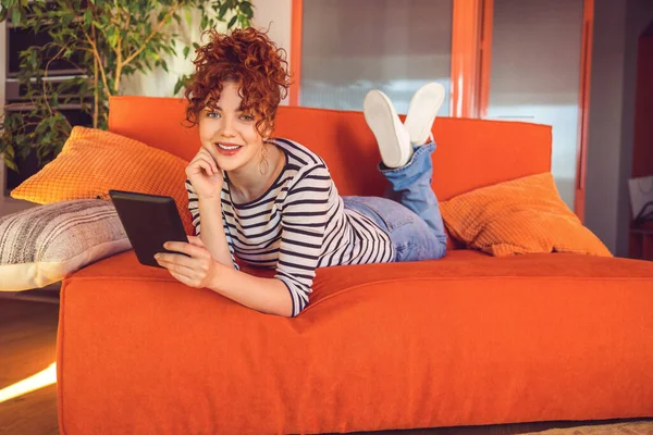 Leisure Ginger Girl Looking Relaxed Spending Time Online — Stockfoto