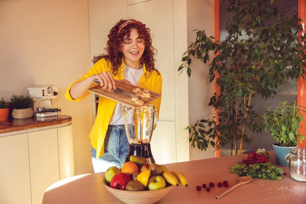 Making Smoothie Young Girl Putting Slices Banana Shaker — Stok fotoğraf