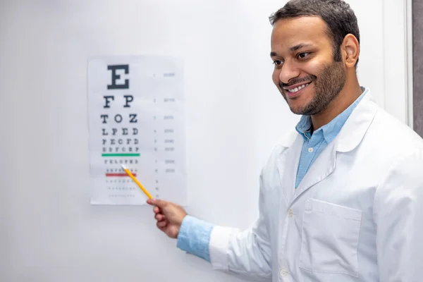 Ophtalmologist Smiling Male Doctor Standing Eyesight Check List — Fotografia de Stock