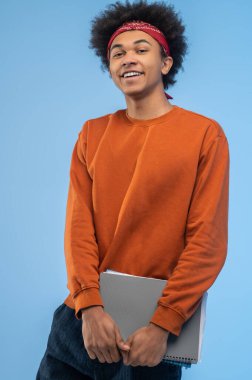Student. Dark-haired young student with notebooks