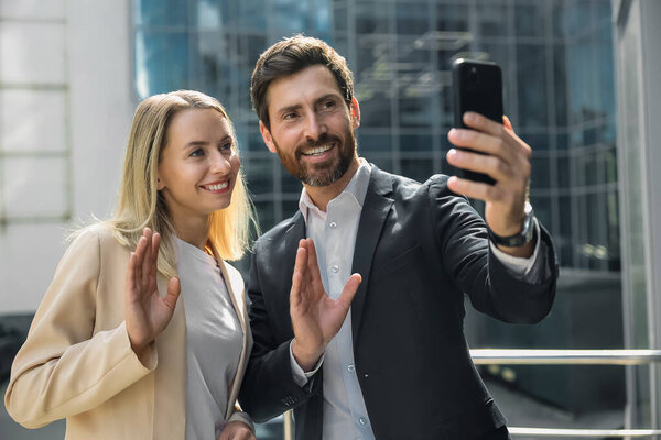 Business talk. Business partners having a video call and smiling
