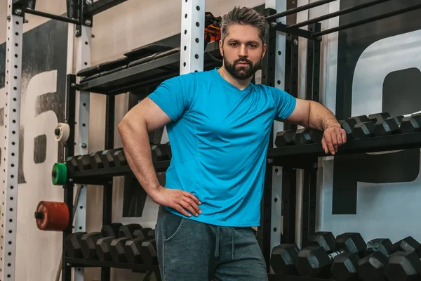 stock image After workout. Man in blue tshirt having rest after a workout