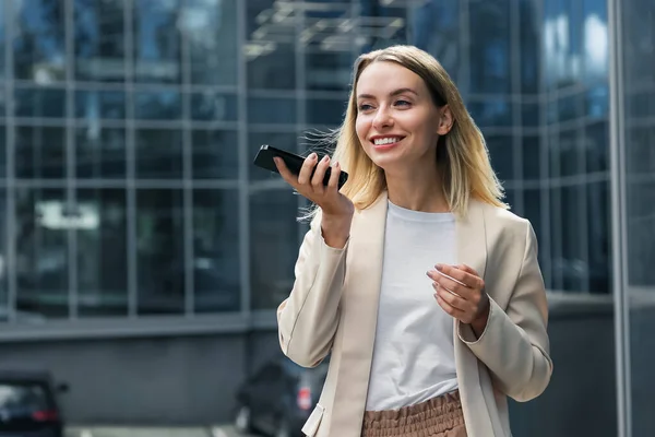 stock image Voice message. Cute blonde elegant woman recording a voice message