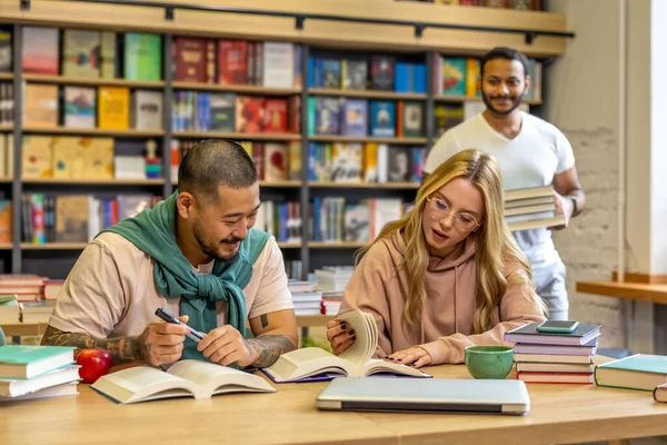 In library. Group of people reading books in library