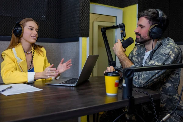 stock image Going live. Two people talking in the live broadcasting on the radio