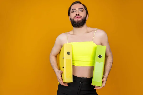 Confident Bearded Transsexual Businessperson Wearing Yellow Top Holding Folders Looking — Stock Photo, Image