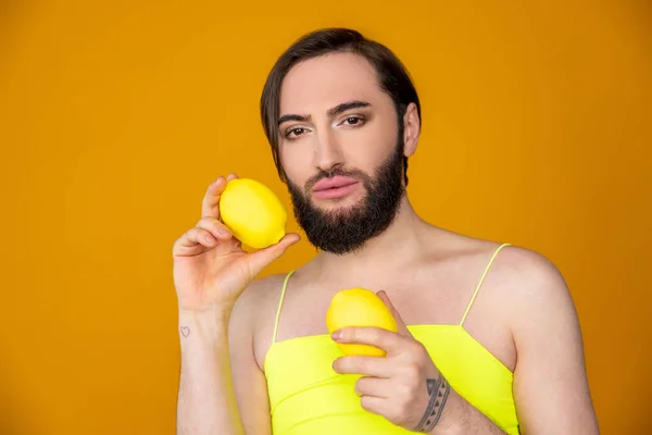 Handsome Graceful Bearded Transsexual Person Wearing Yellow Top Holding Lemon — Stock Photo, Image