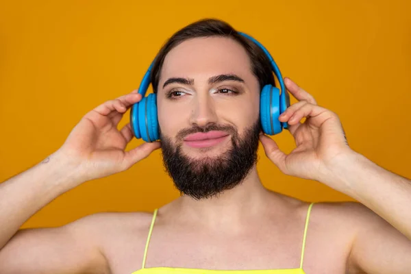 Closeup Portrait Smiling Satisfied Transgender Person Beard Listening Music Blue — Stock Photo, Image