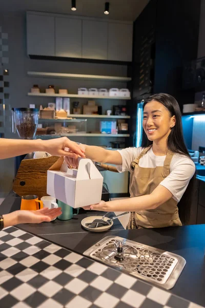Cheerful Female Employee Handing Takeout Dessert Packed Cardboard Box Cafe — Stock Photo, Image