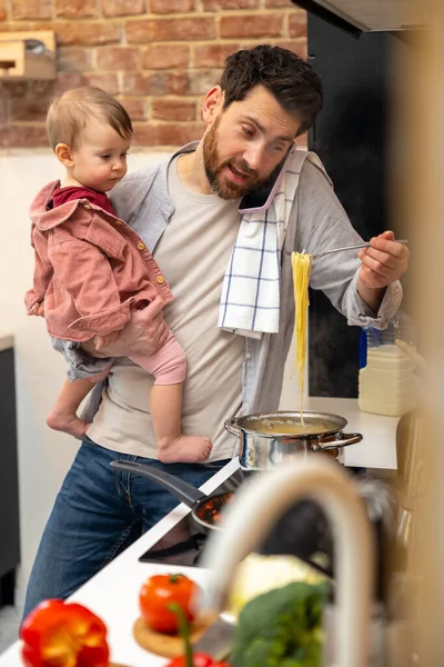 Multitasking Father Babysitting Cooking Breakfast Talking Smart Phone Home Kitchenn — Stock Photo, Image