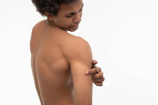 Painful Curly Haired Young Guy Suffering Pain His Shoulder — Stock Photo, Image