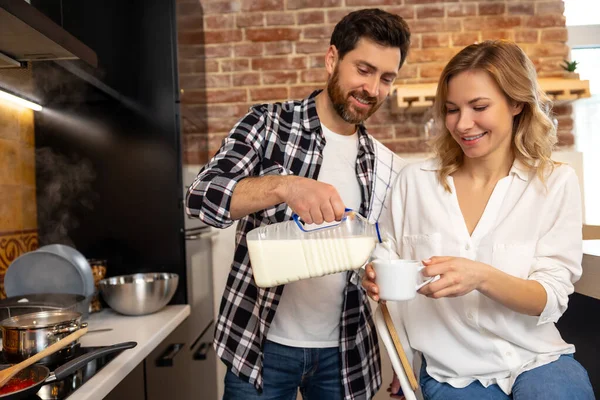 Handsome Young Husband Adding Milk Coffee Creamer His Girlfriend Cup — Stock Photo, Image