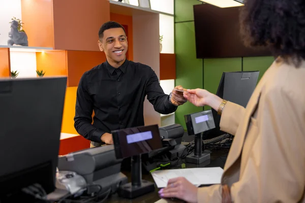 stock image At the hotel. Receptionist helping a guest to check in