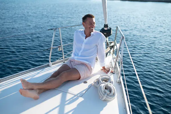 Happy Man Man White Clothes Sitting Yacht Deck Looking Relaxed — Stock Photo, Image