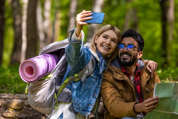 Happy people. Happy travelers making selfie and looking excited