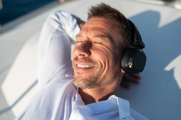 Happy Relaxed Smiling Man Headphones Sailing Yacht Looking Relaxed — Stock Photo, Image