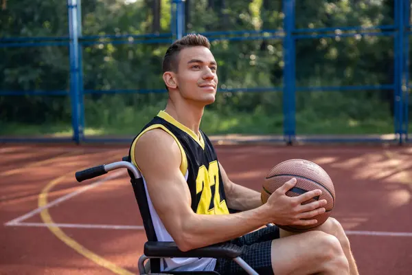 Caucasian man with a disability exercising and has workout at basketball court.