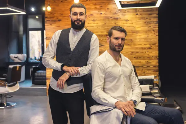 Attractive Man Sitting Chair Barbershop His Master Hairdresser — Stock Photo, Image