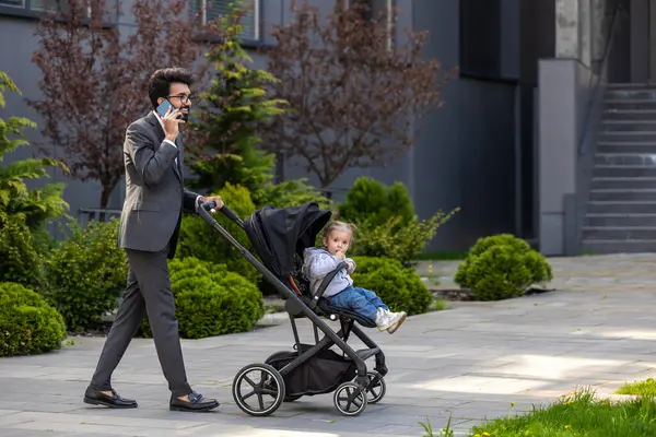 Elegant Young Man Talking Phone Carrying Baby Carriage — Stock Photo, Image