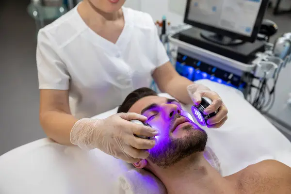 Beauty procedures. Man having cosmetological procedures in a beauty clinic