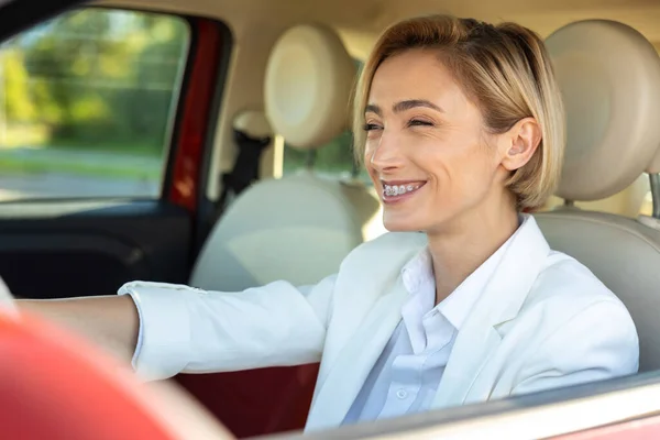 Attractive Smiling Woman Wearing Official Style Suit Keeping Steering Wheel — Stock Photo, Image