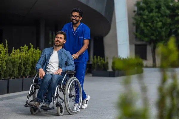 Nurse Patient Brunette Man Doctors Overall Carrying Wheelchair Patient — Stock Photo, Image