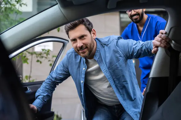 Ready Ride Disabled Man Getting Car Male Nurse Helping Him — Stock Photo, Image
