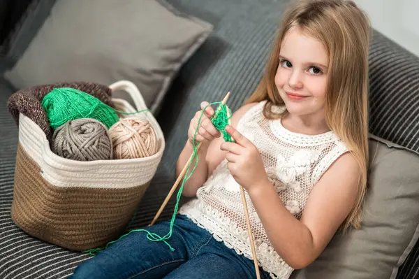 Cute Charming Blond Little Girl Knitting Sofa Home Enjoying Leisure — Stock Photo, Image