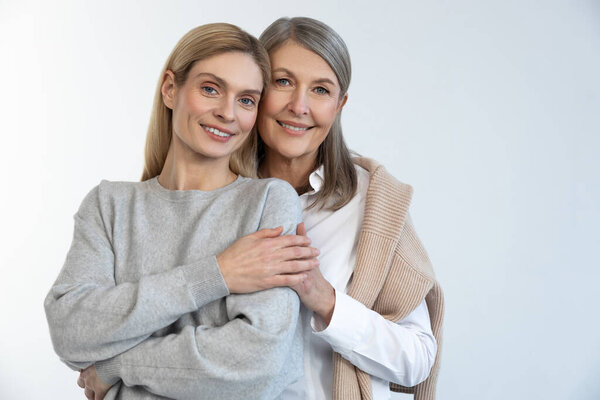 Happy women. Mother and daughter looking happy and confident