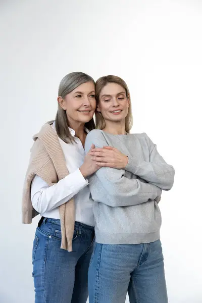 stock image Femininity. Blonde woman and her mom looking contented and confident