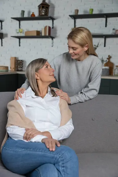 Pleased Adult Mother Daughter Hugging Having Pleasant Conversation Home — Stock Photo, Image
