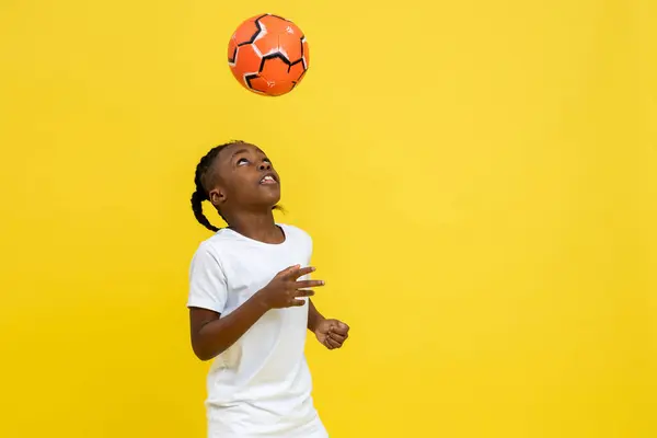 Playful Little Mixed Race Boy Doing Tricks Soccer Ball Isolated Stock Photo