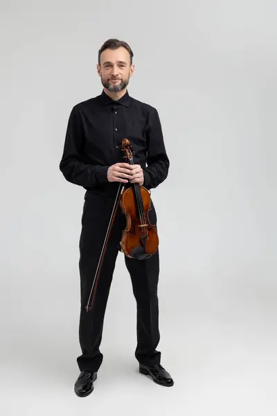 Adult Man Black Shirt Playing Violin Isolated Light Gray Background Stockbild