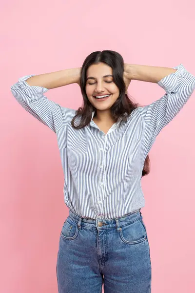 stock image Overjoyed Indian woman keeps hands on head expressing positive emotions isolated over pink background