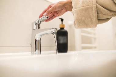 Hand washing. Close up picture on female hands being washed clipart