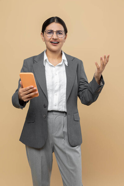 Astonished Indian Woman Official Style Jacket Using Smartphone Managing Calendar Royalty Free Stock Images