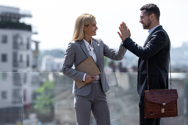 Business Partners Man Woman Standing City Buildings High Fiving Royalty Free Stock Images