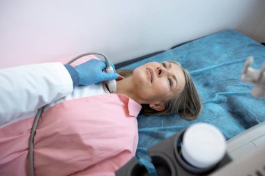 Diagnostics. Close up of a woman lying on a couch in clinic